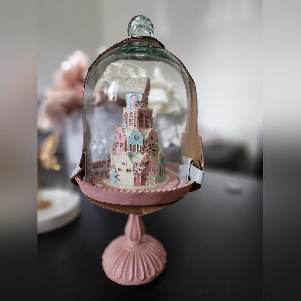 Pastel gingerbread house in cloche
